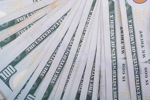 Close up of Benjamin Franklin face on 100 US dollar bill