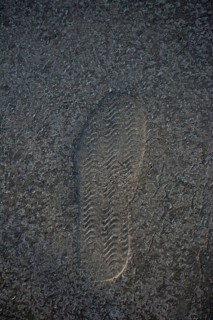 Footstep pattern seen on a concrete background