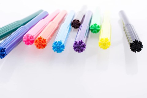 Color felt-tip pens of various color on white background