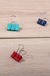 Picture of metallic binder clips with handles in view