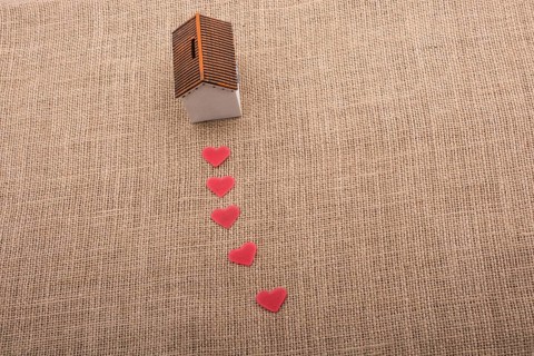 Model house and a heart shape beside it