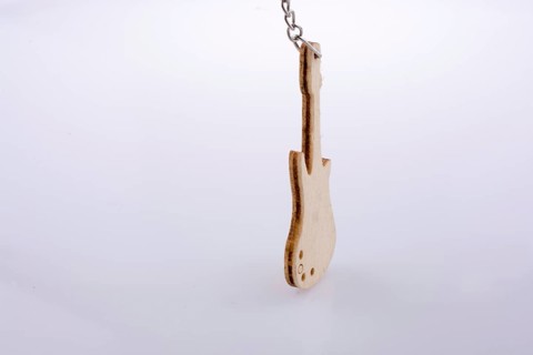Mini wooden guitar model on a white background