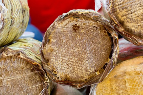 Sweet fresh honey in the sealed comb frame