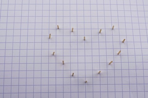Nails make hole on paper forming a heart shape