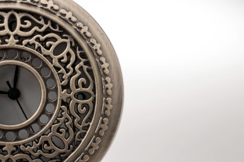 Retro style pocket watch on white background