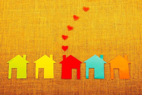Heart shape coming out of chimney of paper house