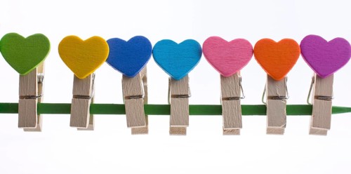 Colorful clothespin attached attached on a line side by side