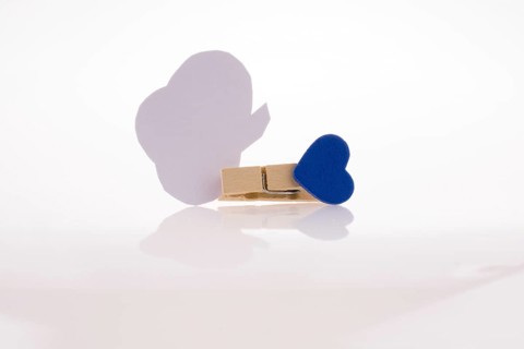 Speech buble clipped with clothespin on a white background