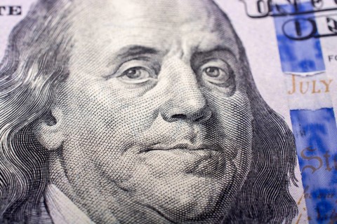 Close up of Benjamin Franklin face on 100 US dollar bill