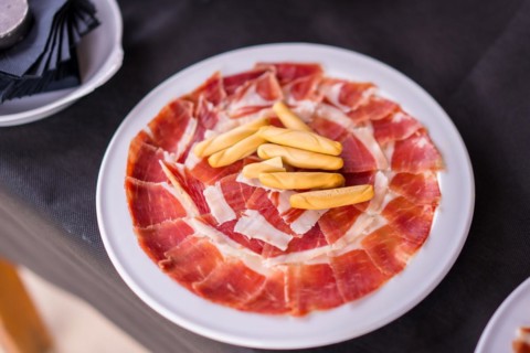 Dish with Iberico ham cut ready to eat