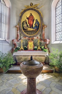 Side altar and baptismal font