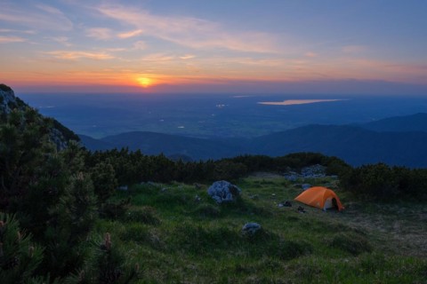 Camping on a mountain meadow in the evening light