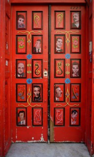 Front door painted with tango motifs in Buenos Aires