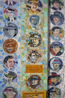 Detail of a mosaic façade with tango musicians