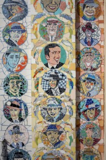 Detail of a mosaic façade with tango musicians