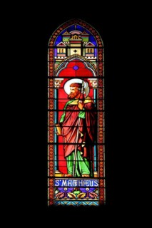 Stained glass window with Matthew of Saint-Dame-du-Bon-Remède Church