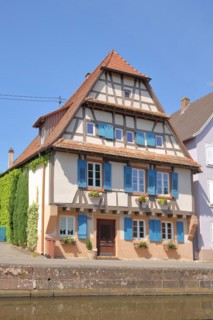 Historic half-timbered house with blue shutters