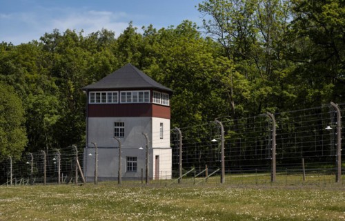 Reconstructed camp fence with watchtower