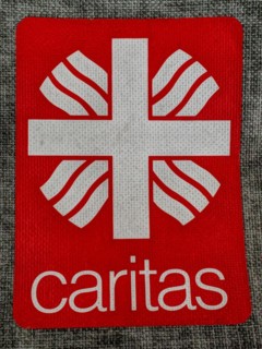 Patch with inscription Caritas