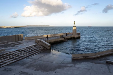 Walkers near the Roger Casement statue at Dun Laoghaire baths enjoy a fresh