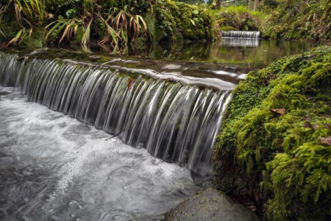 Water flowing on a cold day at the Tobernalt Holy Well and grotto near Sligo