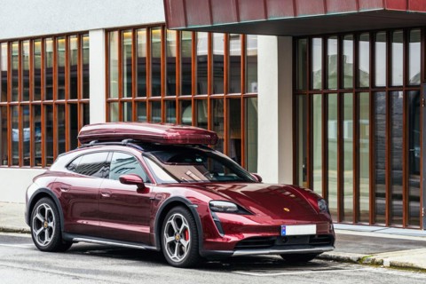 Brown Porsche Panamera with roof box