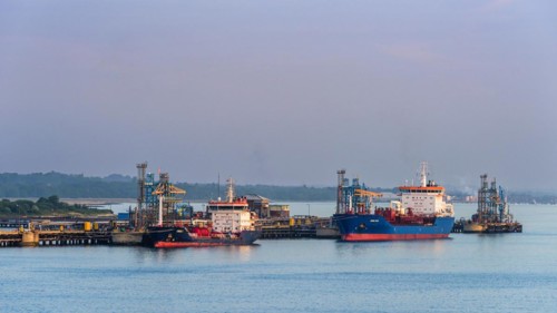 Sunrise over Gas tankers and Esso Oil Terminal