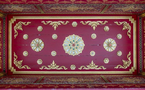 Red ceiling with golden floral ornaments in the Siamese Temple Sala-Thai I