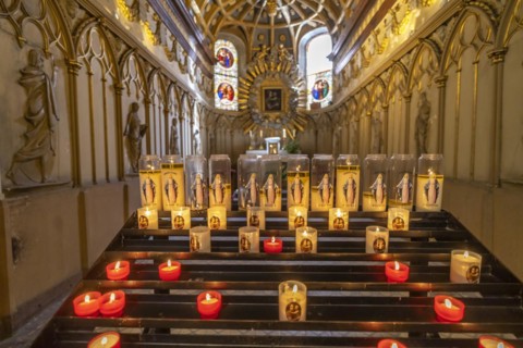 Sacrificial candles in a chapel of St John's Cathedral in Besancon