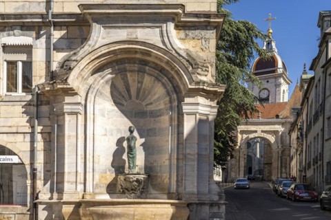 Fountain in the old town and St John's Cathedral in Besancon