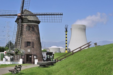 The windmill Scheldedijkmolen and cooling towers of the Doel Nuclear Power Station along the river Scheldt at Kieldrecht