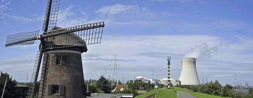 The windmill Scheldedijkmolen and cooling towers of the Doel Nuclear Power Station along the river Scheldt at Kieldrecht