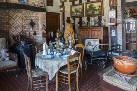 Old dining room with antique furniture and vintage chairs and table at the open air museum Bachten de Kupe