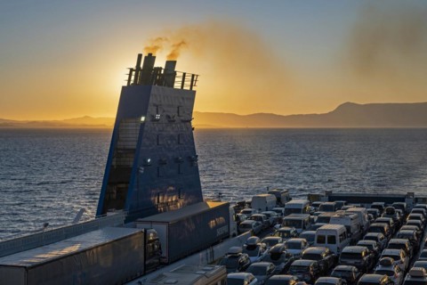Car ferry from Grimaldi Lines sailing on the Adriatic Sea at sunset from Italy to Igoumenitsa in Greece