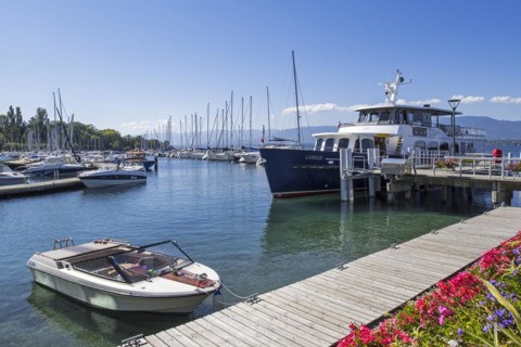 CGN passenger ferry boat Lavaux and sailing boats in the marina at Yvoire along Lake Geneva