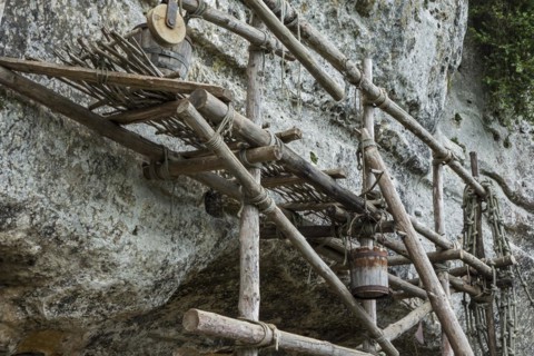 Medieval wooden scaffolding at the fortified troglodyte town La Roque Saint-Christophe