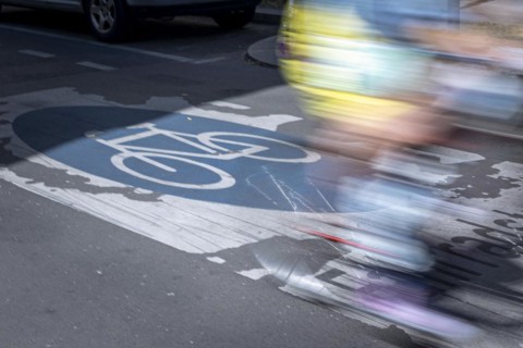 A cyclist rides over markings on a bicycle road in Berlin