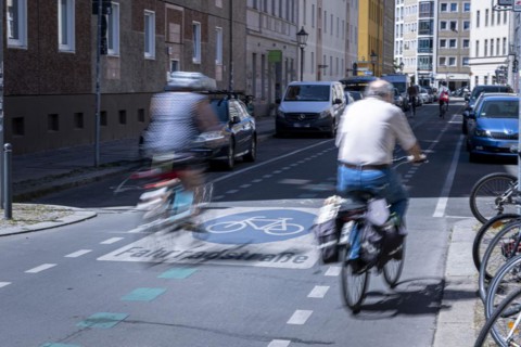 Cyclists riding over markings on a bicycle road in Berlin