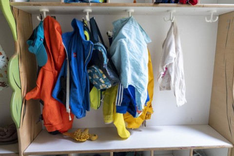 Jackets and shoes at a cloakroom in a kindergarten