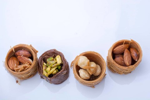 Nut stuffed dessert of mini size cuisine on a plate