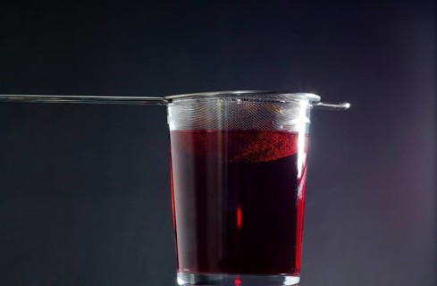Drinking Glass with Strainer of Red Tea