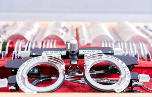 Diopter lens with lenses in ophthalmological test box. Ophthalmological messbrille and lens kit