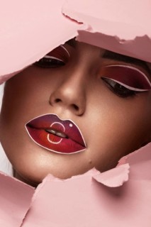 Beautiful woman with creative makeup and purple lips. Beauty face. Art makeup