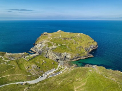 Aerial view of the rugged coastline on the Celtic Sea with the Tintagel Peninsula and the ruins of Tintagel Castle
