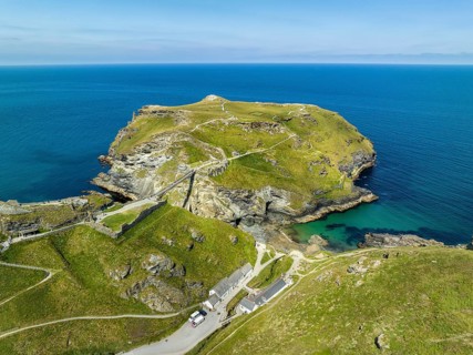 Aerial view of the rugged coastline on the Celtic Sea with the Tintagel Peninsula and the ruins of Tintagel Castle
