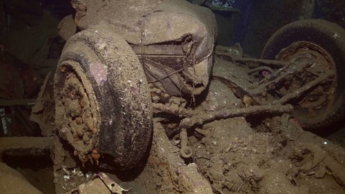 Overturned car and other cargo inside hold of ferry Salem Express shipwreck