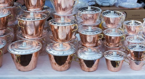 Little set of buckets of made of metal in a market place