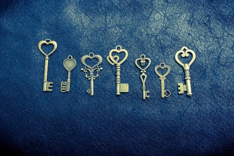Heart shaped retro metal keys on dark background