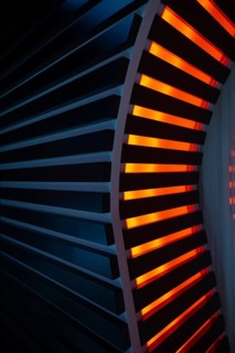 Illuminated Orange Stripes on a Modern Column in Switzerland