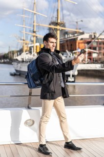 Handsome tourist taking selfies in Puerto Madero
